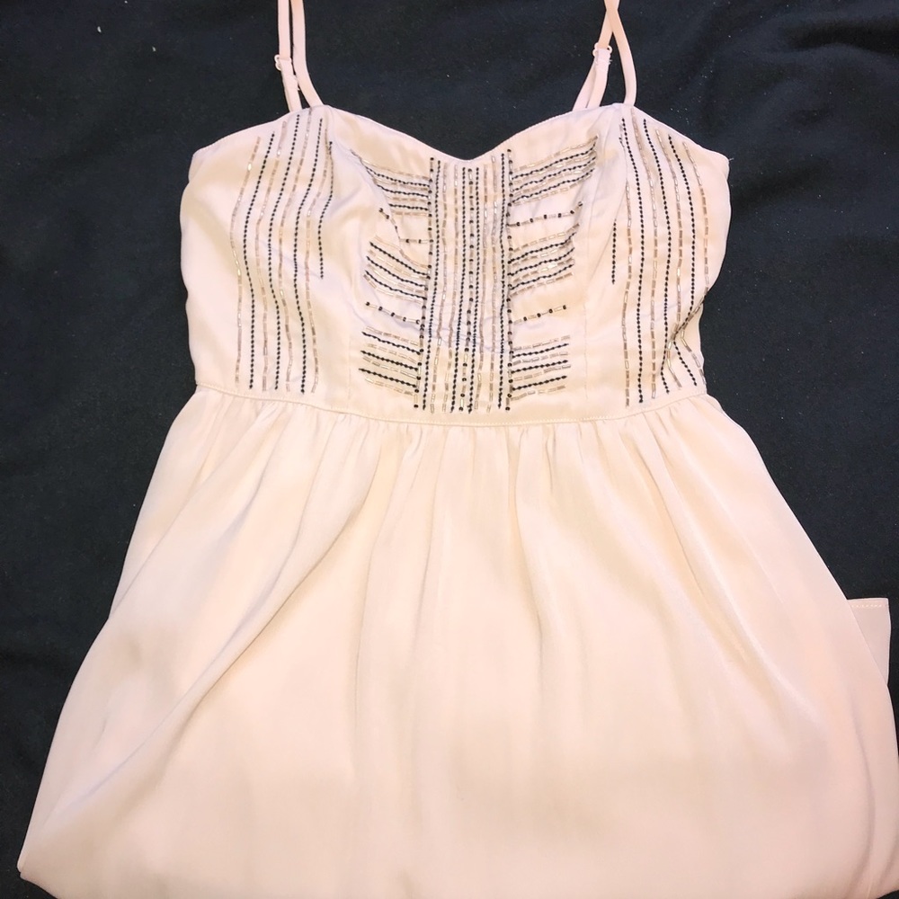 nude fit and flare dress with cutout in back